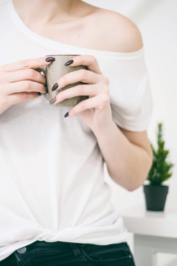 Photo of Woman Holding Mug